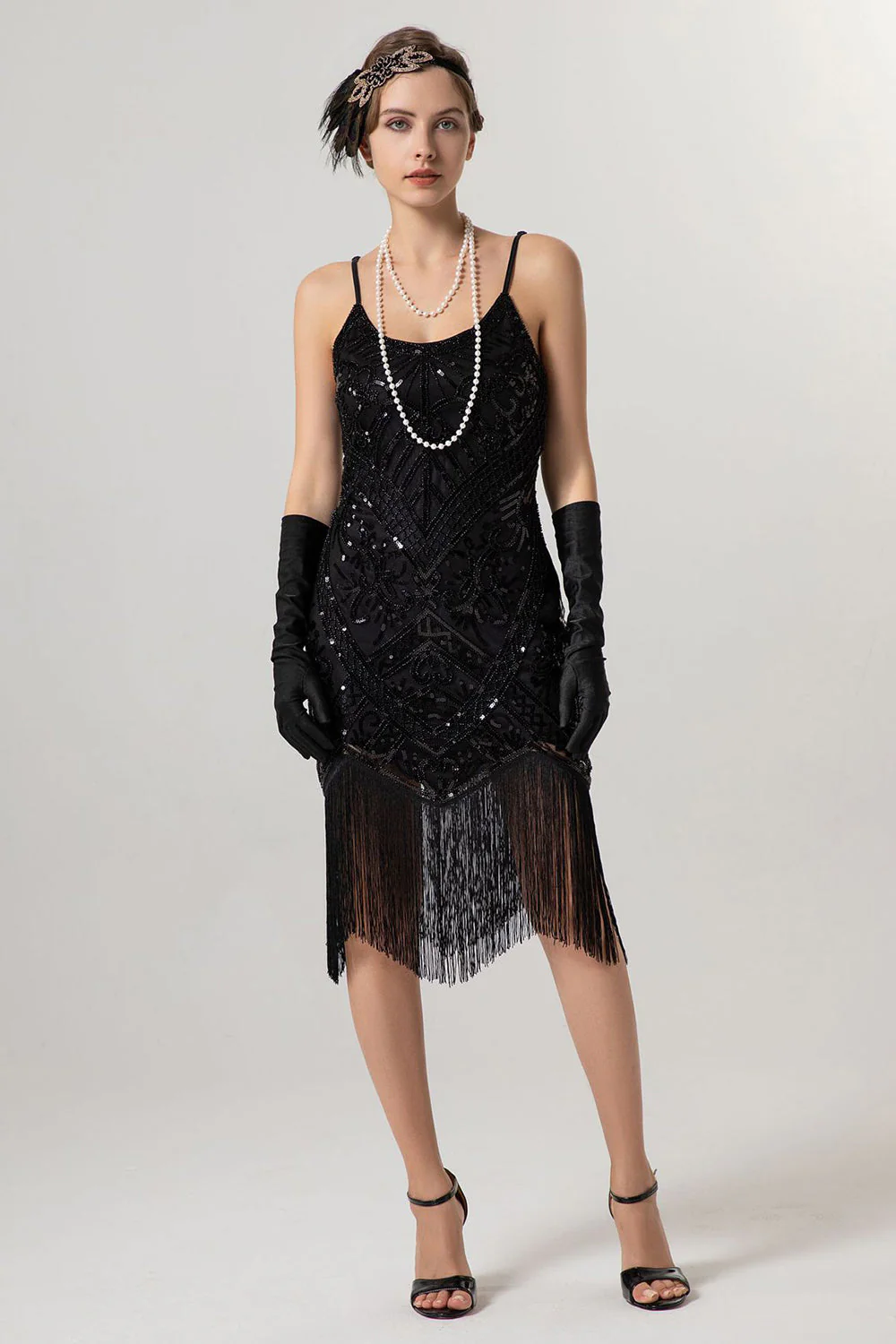 Robe années 20 noire et dorée à paillettes et pompons - Image 6