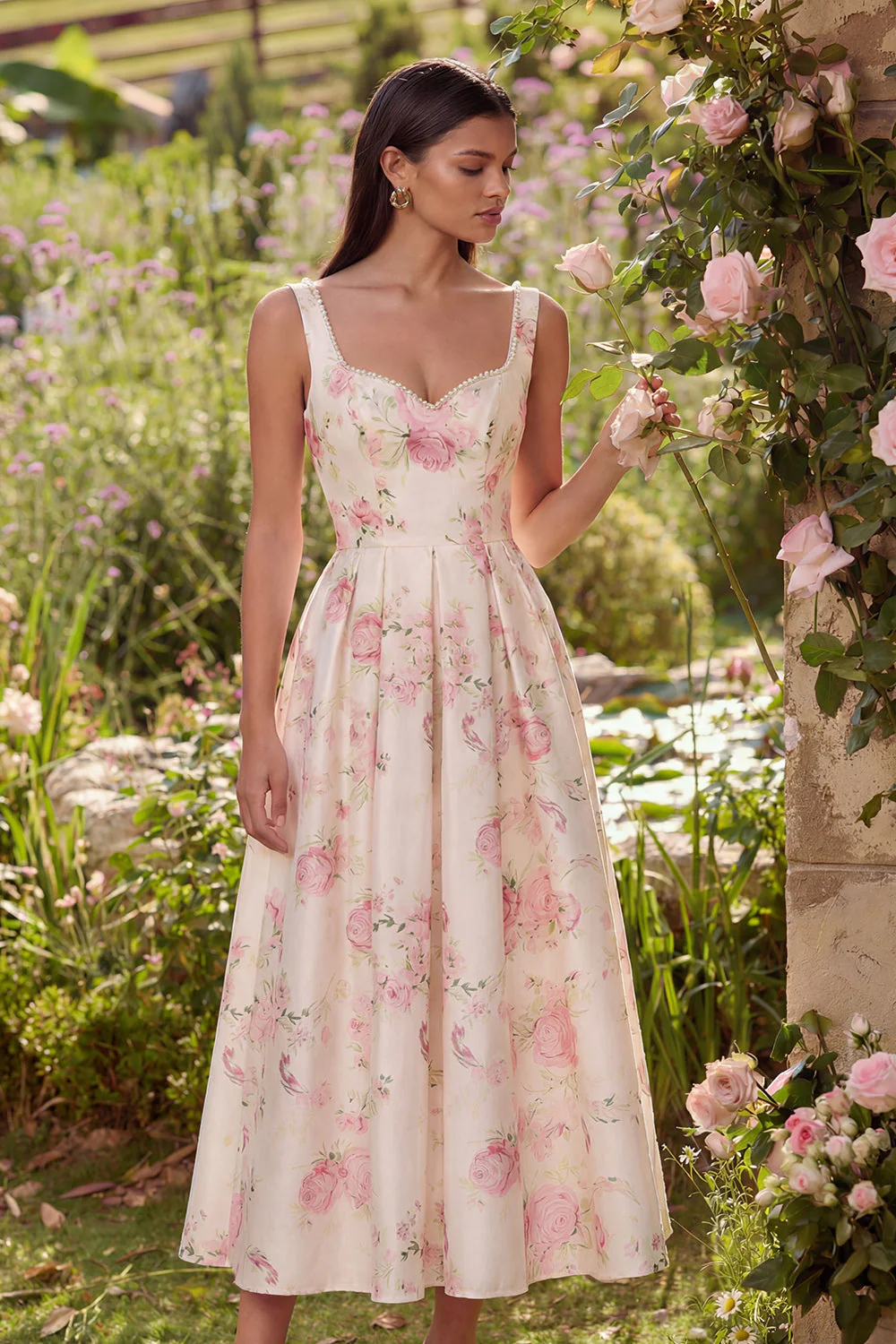 Robe midi rose à dos sans dos en satin à motif fleur avec nœud papillon