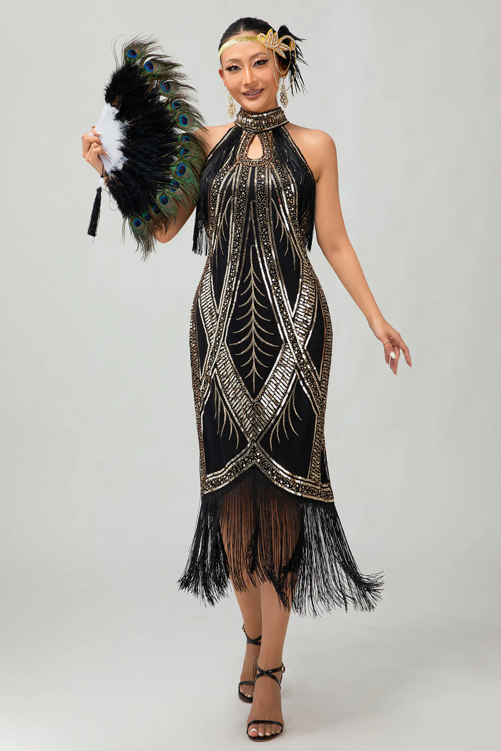 Robe style années 20 noire et dorée à franges et paillettes