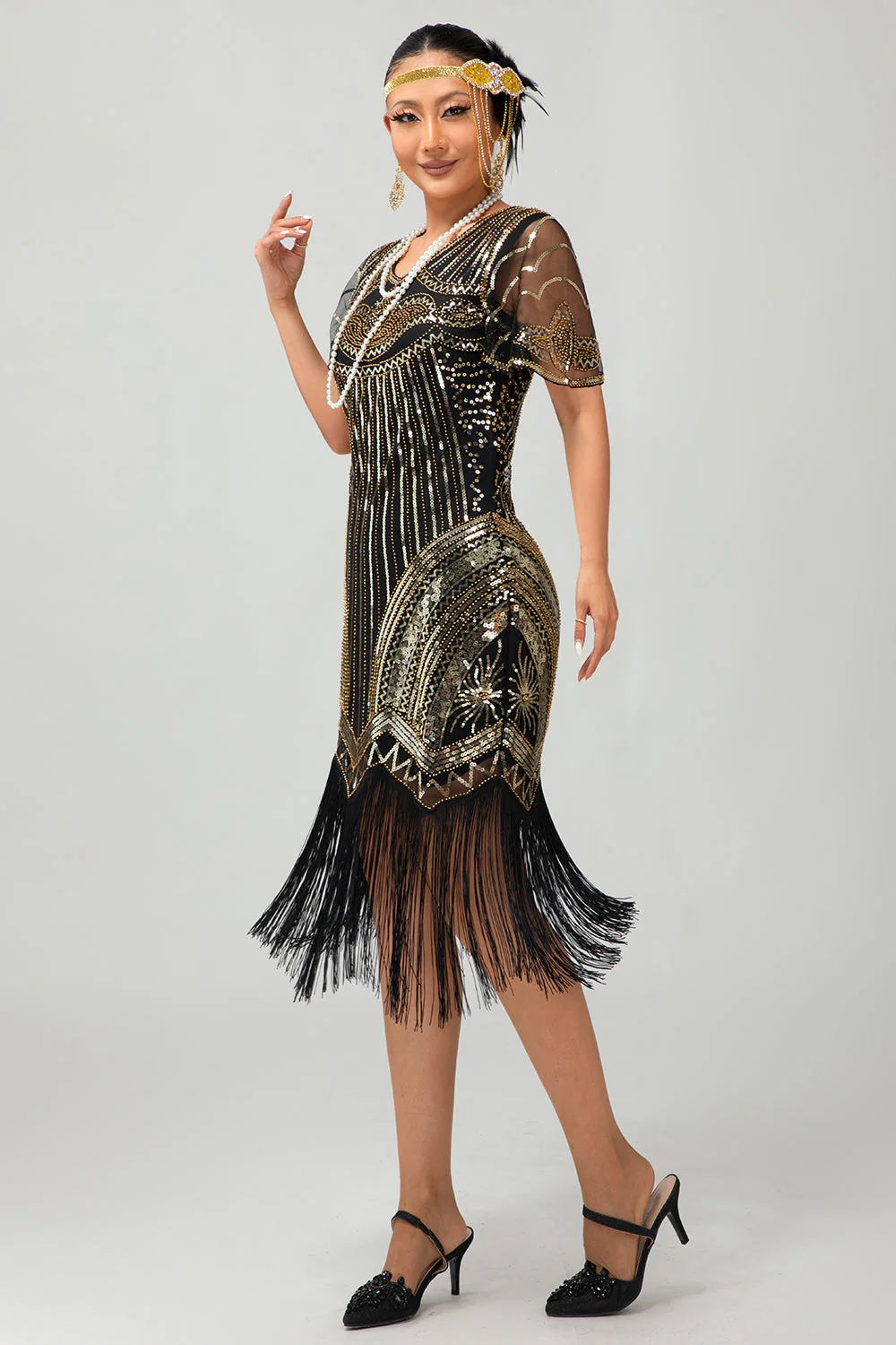 Robe années 20 noire et dorée moulante à paillettes avec pompons - Image 7