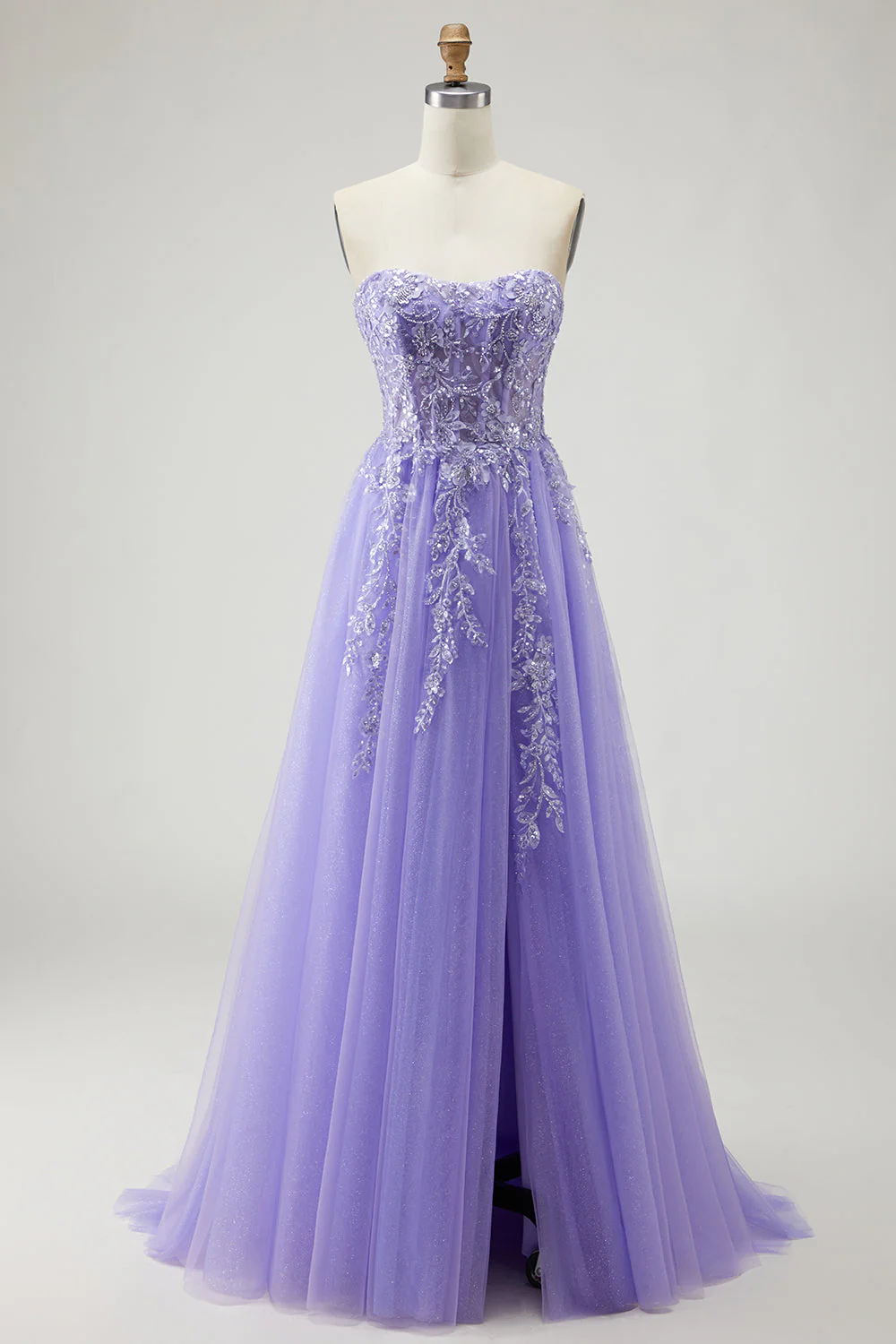 Une robe de bal longue violette appliquée à manches sans bretelles décapotable décapotable